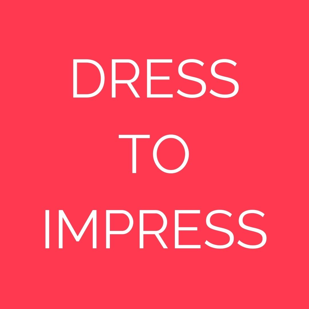 Schriftzug 'DRESS TO IMPRESS' auf rotem Hintergrund